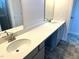 Bathroom featuring double vanity with white countertops, modern sinks, and tile floors at 346 Olivia Crossing Ct # 12, Four Oaks, NC 27524