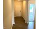 Inviting hallway with wood-look flooring leading to the front door and living areas at 346 Olivia Crossing Ct # 12, Four Oaks, NC 27524