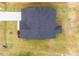 Aerial view of home highlighting the roof and surrounding landscaping at 490 Barbour Farm Ln, Four Oaks, NC 27524