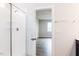 Modern bathroom showcasing a glass-enclosed shower with white tile, and a view into the bedroom at 490 Barbour Farm Ln, Four Oaks, NC 27524