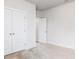 Bedroom featuring carpet, white doors, and natural light at 490 Barbour Farm Ln, Four Oaks, NC 27524