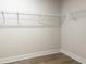 Walk-in closet featuring wood floor and wire shelving at 490 Barbour Farm Ln, Four Oaks, NC 27524