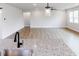 Open-concept kitchen featuring a granite island, modern faucet, and flows into a spacious living area at 490 Barbour Farm Ln, Four Oaks, NC 27524