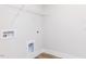 Spacious laundry room with connections for washer and dryer, and white paint at 490 Barbour Farm Ln, Four Oaks, NC 27524