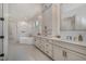 Spa-like bathroom featuring a soaking tub, a separate shower, and dual vanities at 736 Golfers View Vw, Pittsboro, NC 27312