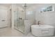 Modern bathroom with a glass shower and a luxurious soaking tub at 736 Golfers View Vw, Pittsboro, NC 27312