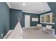 Cozy bedroom with carpet, a decorative teepee, white trim and a large window at 736 Golfers View Vw, Pittsboro, NC 27312