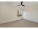 Well lit bedroom featuring carpet, a ceiling fan and a large window at 736 Golfers View Vw, Pittsboro, NC 27312