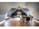 Finished attic room with vaulted ceilings, a ceiling fan, hardwood floors and plenty of natural light at 736 Golfers View Vw, Pittsboro, NC 27312