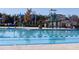 Community pool featuring zero-entry access, slide, and shade structures with plentiful poolside seating at 736 Golfers View Vw, Pittsboro, NC 27312