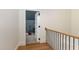 Upstairs hallway leading to carpeted room with a guitar on display at 736 Golfers View Vw, Pittsboro, NC 27312