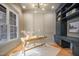 Bright home office featuring custom built-ins, detailed trim, and hardwood floors at 736 Golfers View Vw, Pittsboro, NC 27312
