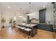Open-concept kitchen featuring a large island with seating and plenty of natural light at 736 Golfers View Vw, Pittsboro, NC 27312