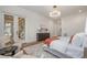 Bright main bedroom with hardwood floors, French doors, and stylish furnishings at 736 Golfers View Vw, Pittsboro, NC 27312