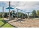 Community playground featuring a variety of play structures including slides, swings, and climbing wall at 736 Golfers View Vw, Pittsboro, NC 27312
