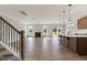 Bright living area features hardwood floors, a cozy fireplace, and seamless transition to the kitchen at 1224 Cricket St, Elon, NC 27244