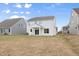 Expansive backyard with a covered patio, ideal for outdoor entertaining and relaxation at 1228 Cricket St, Elon, NC 27244