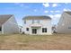 Spacious backyard surrounded by neighboring homes, offering a sense of community at 1228 Cricket St, Elon, NC 27244
