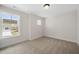 Bright bedroom with neutral carpet, large window, and fresh white paint at 1228 Cricket St, Elon, NC 27244