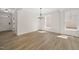 Bright dining area with wood floors, elegant chandelier, and ample natural light at 1228 Cricket St, Elon, NC 27244
