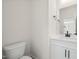 Modern half bathroom with a white vanity, sleek fixtures, and a clean, minimalist design at 1228 Cricket St, Elon, NC 27244