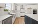 Elegant kitchen featuring white cabinets, stainless steel appliances, and granite countertops at 1228 Cricket St, Elon, NC 27244
