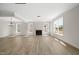 Spacious living room with a fireplace, large windows, and natural light at 1228 Cricket St, Elon, NC 27244