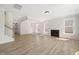An open floor plan features a spacious living room, fireplace, and staircase at 1228 Cricket St, Elon, NC 27244