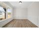 Bright office space with wood floors and large windows providing ample natural light at 1228 Cricket St, Elon, NC 27244
