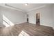 Spacious bedroom with hardwood floors, showing an attached bathroom and walk in closet at 1232 Cricket St, Elon, NC 27244