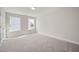 Bright bedroom featuring plush carpeting, neutral walls and two windows offering natural light at 1232 Cricket St, Elon, NC 27244