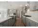 Spacious kitchen with an island, stainless steel sink, and plentiful counter space for cooking at 1232 Cricket St, Elon, NC 27244