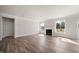 Spacious living room featuring a fireplace, and windows that provide ample natural light at 1232 Cricket St, Elon, NC 27244