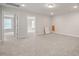 Large living area featuring a gray carpet and multiple doors at 1232 Cricket St, Elon, NC 27244