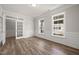 Bright home office featuring wood floors, wainscoting, and natural light from large windows at 1232 Cricket St, Elon, NC 27244