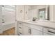 Bright bathroom featuring a quartz countertop, black hardware, and modern fixtures at 1301 Cricket St, Elon, NC 27244