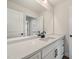New bathroom featuring a white vanity, a large mirror and sleek, matte black hardware at 1301 Cricket St, Elon, NC 27244