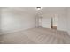 Spacious bedroom with neutral carpet, white trim and access to the ensuite bathroom at 1301 Cricket St, Elon, NC 27244