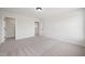 Clean bedroom with plush carpet, neutral paint, and a closet in the entryway at 1301 Cricket St, Elon, NC 27244