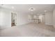 Spacious bonus room with plush carpeting, ample lighting, and access to adjacent rooms offers versatile living space at 1301 Cricket St, Elon, NC 27244