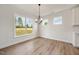 Bright dining room with large windows overlooking the beautiful backyard at 1301 Cricket St, Elon, NC 27244