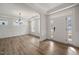 Inviting foyer with hardwood floors, decorative molding, and an open concept living area at 1301 Cricket St, Elon, NC 27244