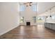 Open concept living room with fireplace and large windows for natural light at 1301 Cricket St, Elon, NC 27244