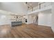 Open concept living area with kitchen, stairway and hardwood floors throughout at 1301 Cricket St, Elon, NC 27244