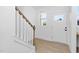 Light-filled entryway with stairs and front door at 329 & 331 Roxboro St, Haw River, NC 27258
