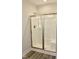 A bathroom featuring a shower with sliding glass doors and modern fixtures at 59 Mossy Bridge Ct, Lillington, NC 27546