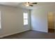 An open bedroom featuring a ceiling fan and a walk-in closet with wire shelving at 59 Mossy Bridge Ct, Lillington, NC 27546