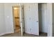 Bedroom with an open closet and a view of the bathroom at 59 Mossy Bridge Ct, Lillington, NC 27546