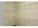 A closet is shown, outfitted with multiple tiers of bright white wire shelving at 59 Mossy Bridge Ct, Lillington, NC 27546