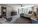 This is a main bedroom with a large window, stylish furniture, and neutral colors for a calm atmosphere at 684 Magnolia Acres Ln, Fuquay Varina, NC 27526